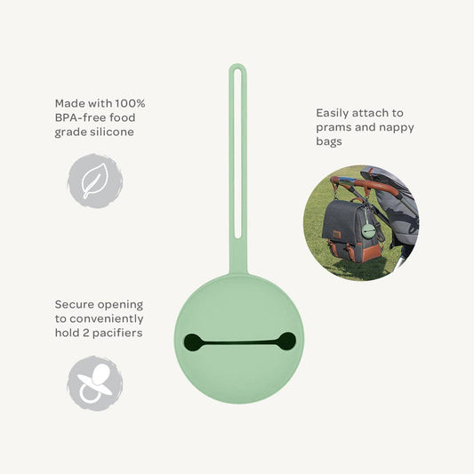 Green silicone pacifier holder with features listed on a white background