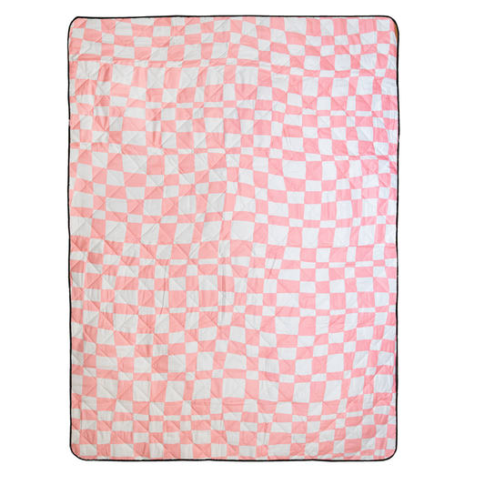 Pink and white checkered blanket on a white background