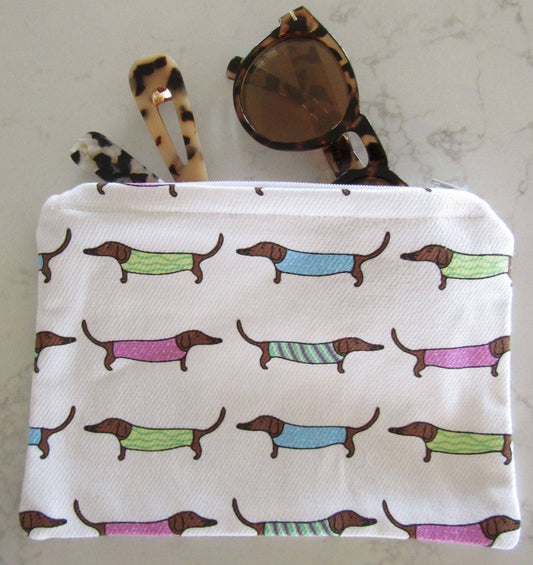 Small pouch with dachshund pattern on a marble surface