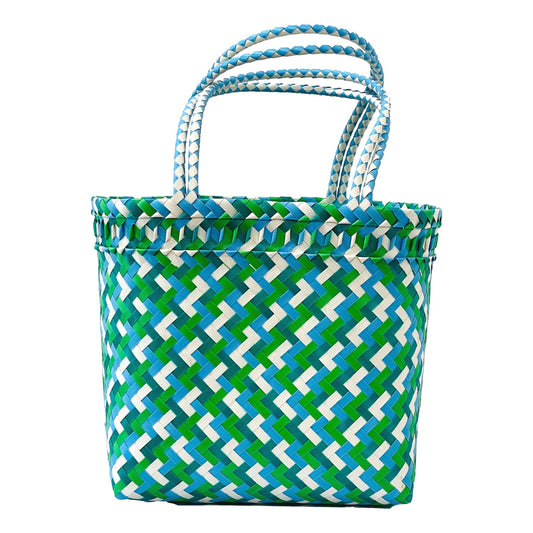 Tote bag with green and blue geometric pattern on a white background