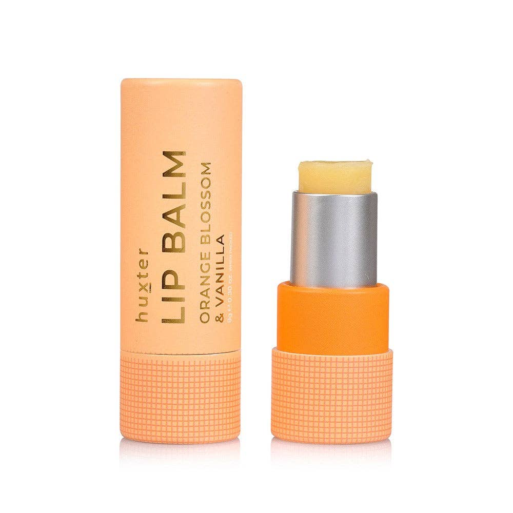Lip balm with orange packaging on a white background