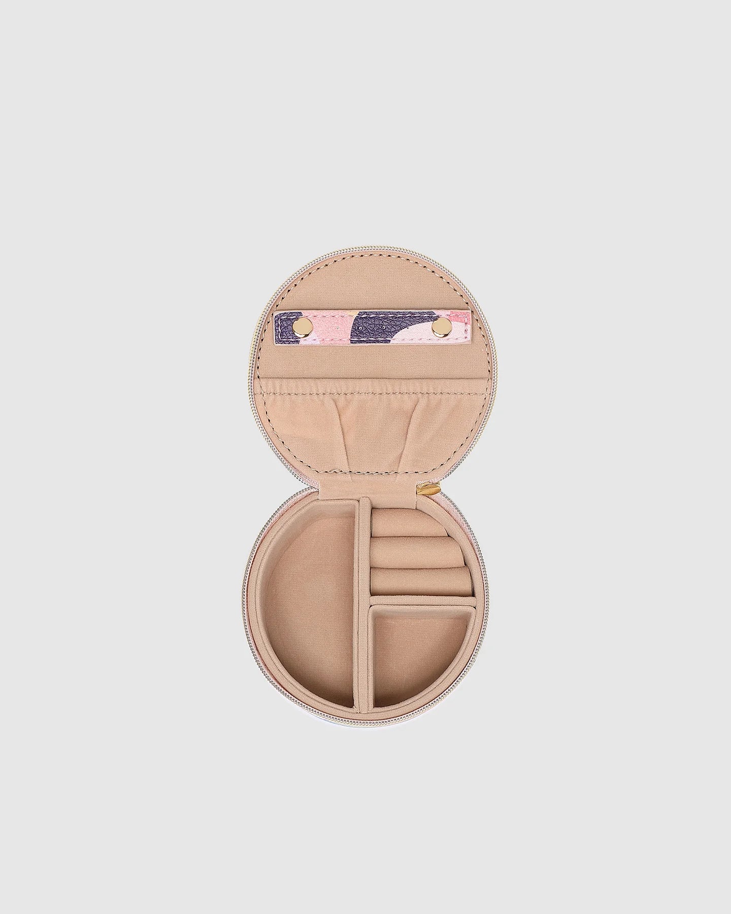 Open beige jewelry case with compartments on a light gray background