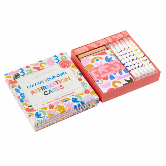 Color-your-own affirmation cards with markers in a box on a white background