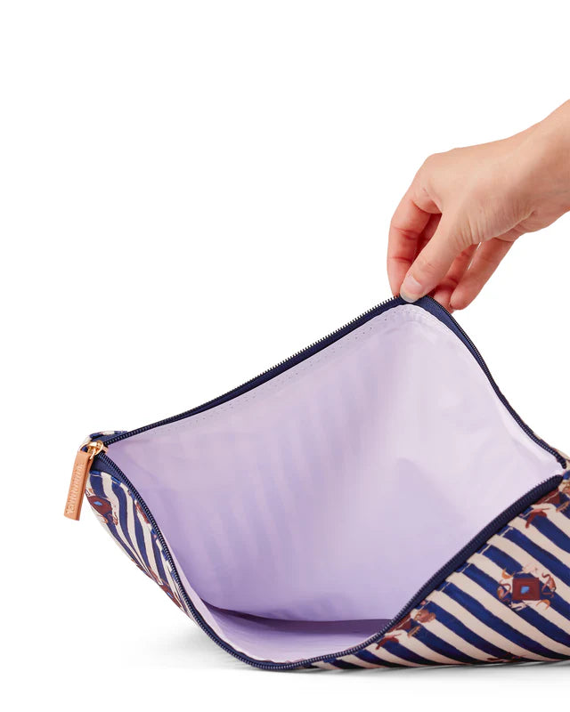 Hand opening a striped pouch with a purple interior on a white background
