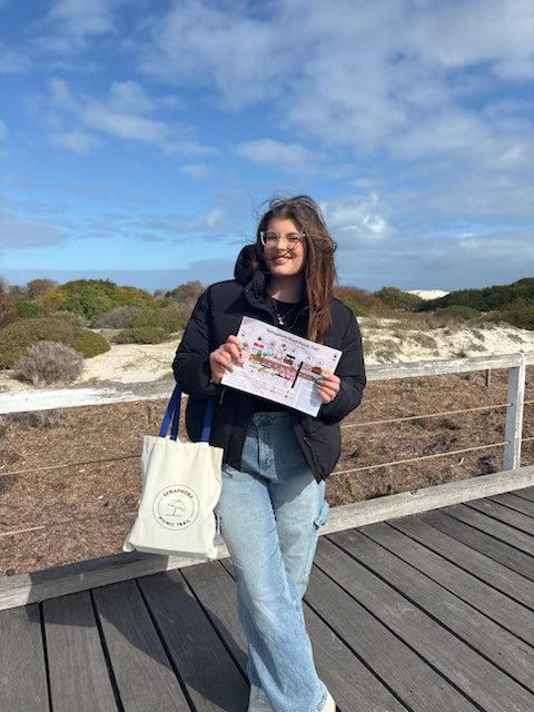 girl at beach Picnic with picnic Trail Bag and Map