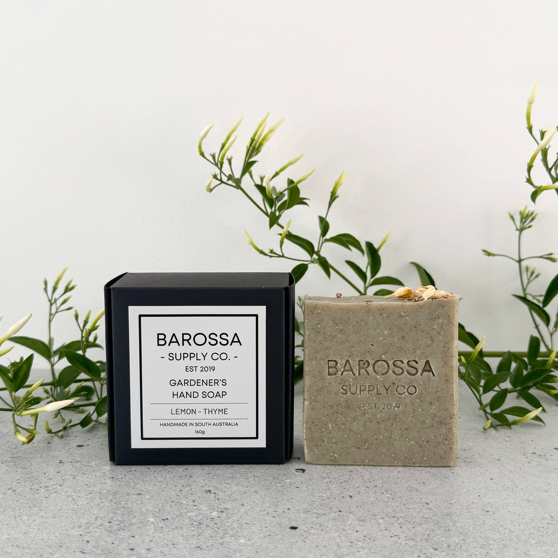 Barossa Supply Co. hand soap bar and packaging on a light background with greenery.
