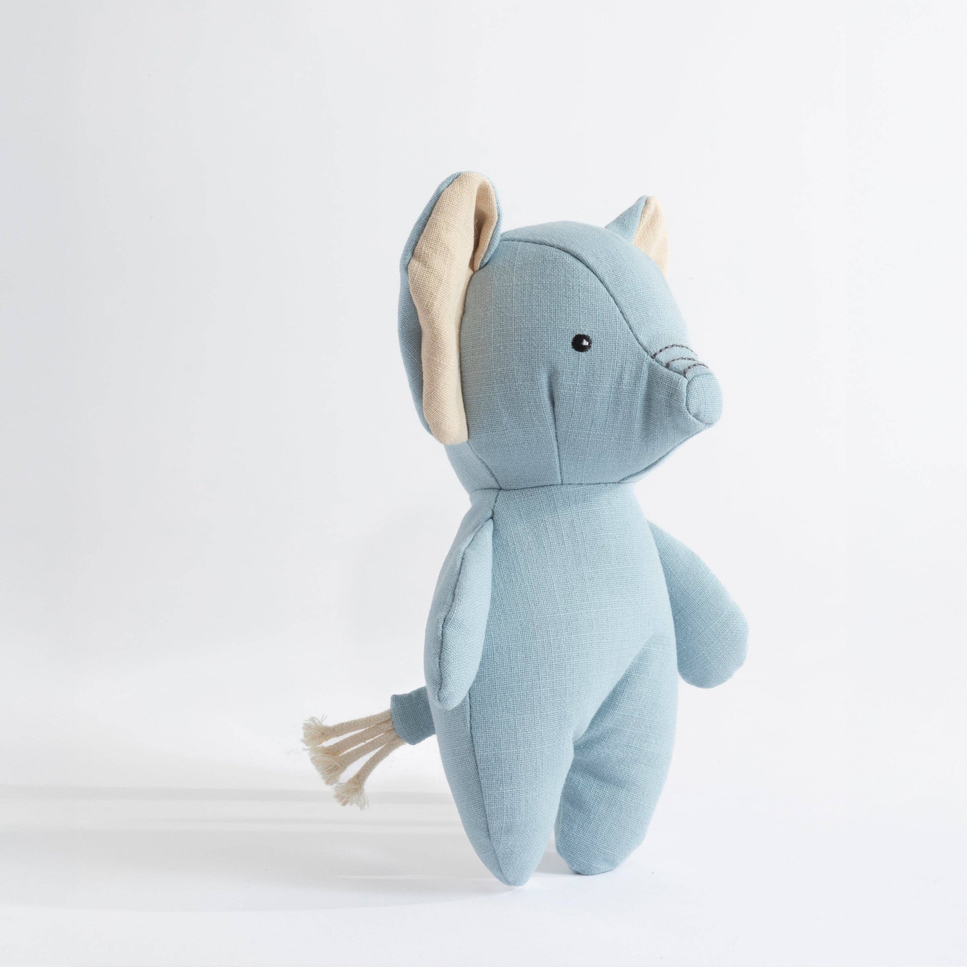 Blue stuffed animal toy on a white background