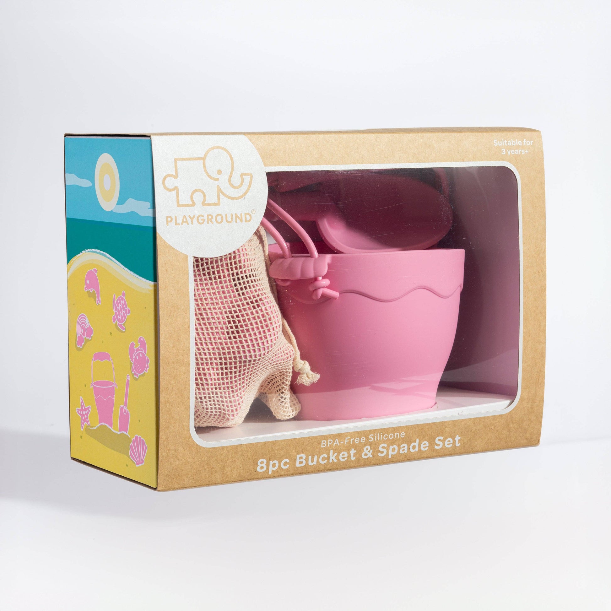 Pink bucket and spade set in a 'Playground' branded box on a white background