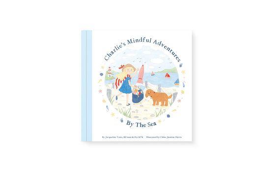 Cover of the book 'Charlie's Mindful Adventures By The Sea' featuring an illustration of a child and a dog on the beach.