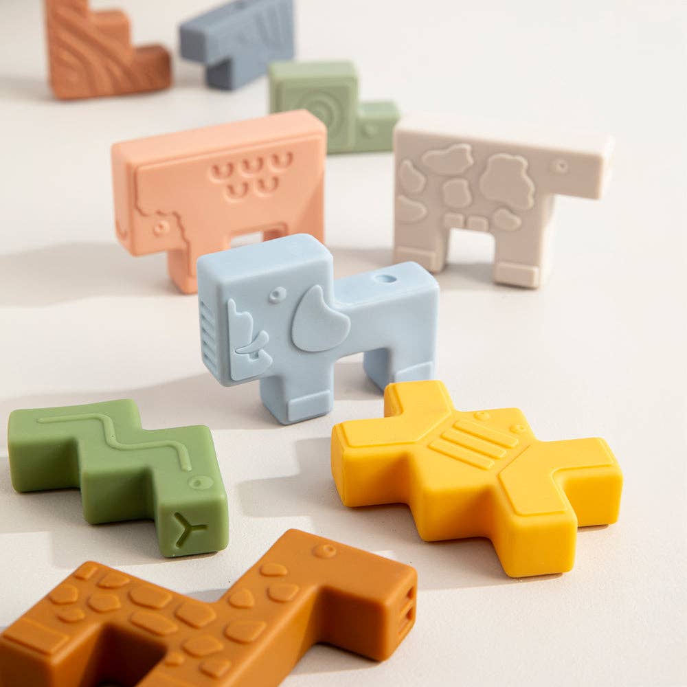 Colorful animal-shaped blocks on a light surface