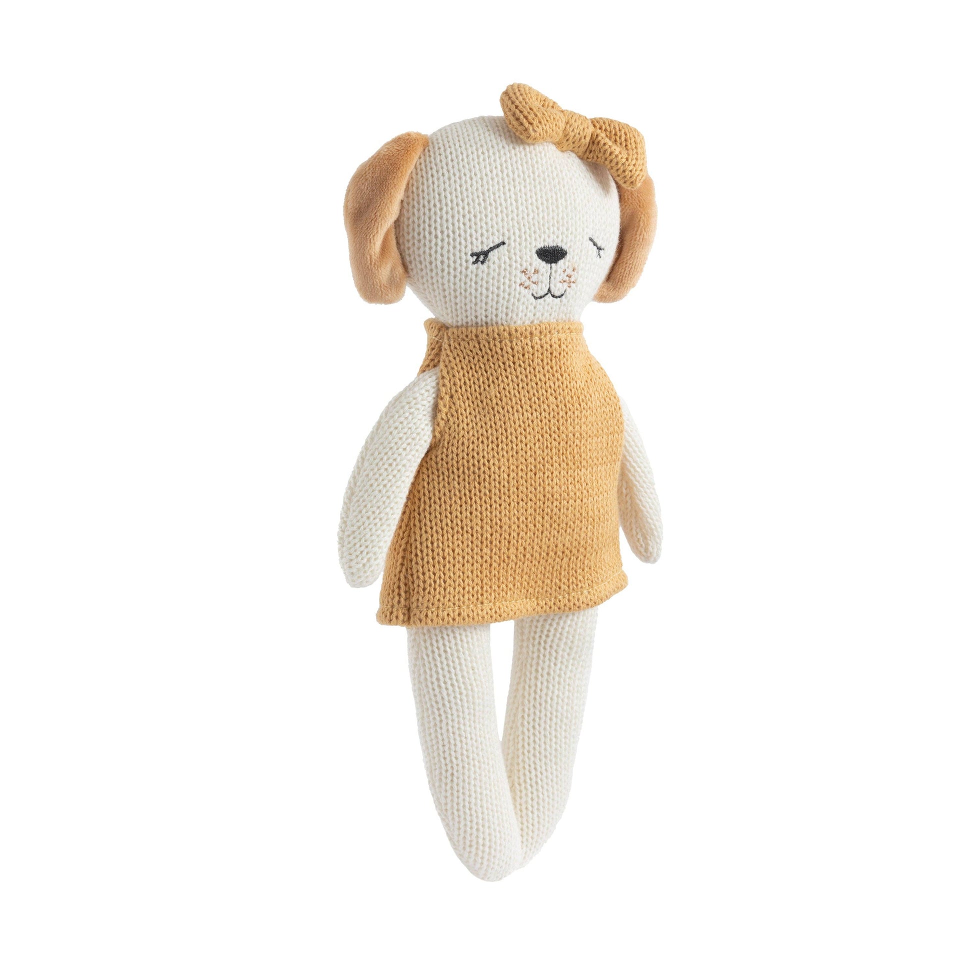 Knitted dog toy with a mustard yellow dress on a white background