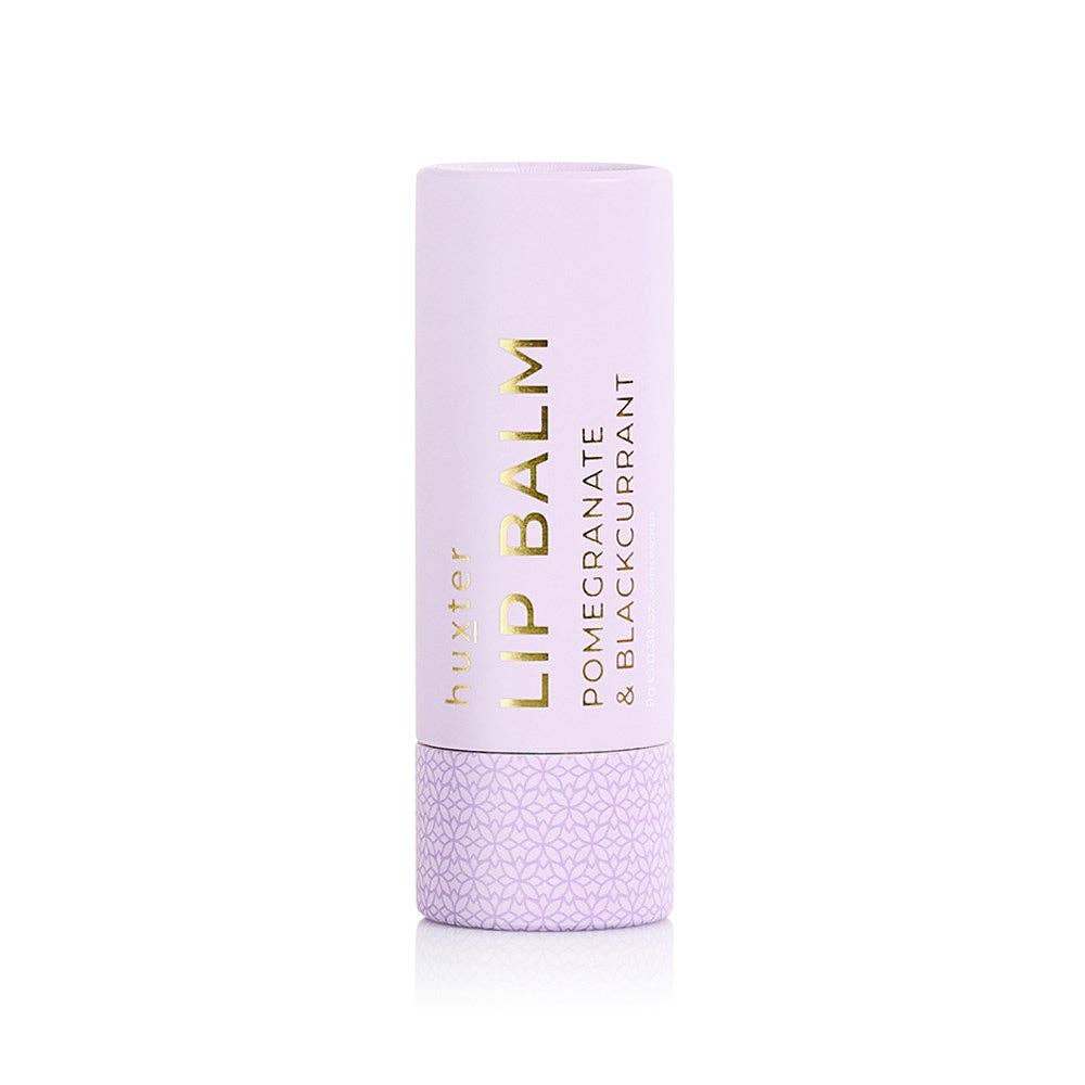 Lip balm container with purple lid and body on a white background