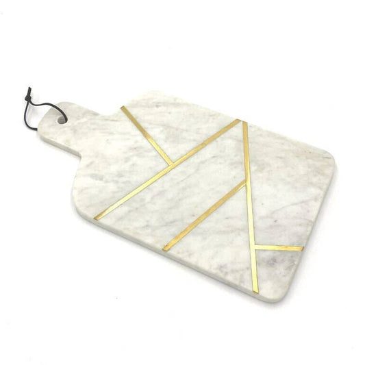 Marble cutting board with gold geometric design on a white background