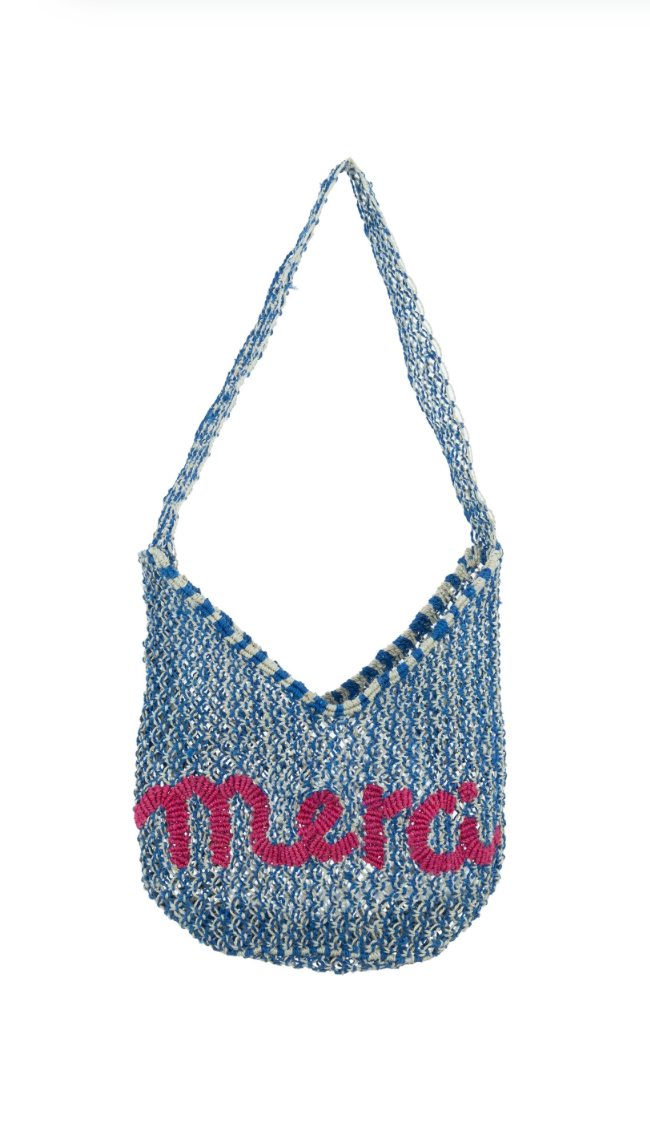 Blue textured handbag with 'merci' text on a white background