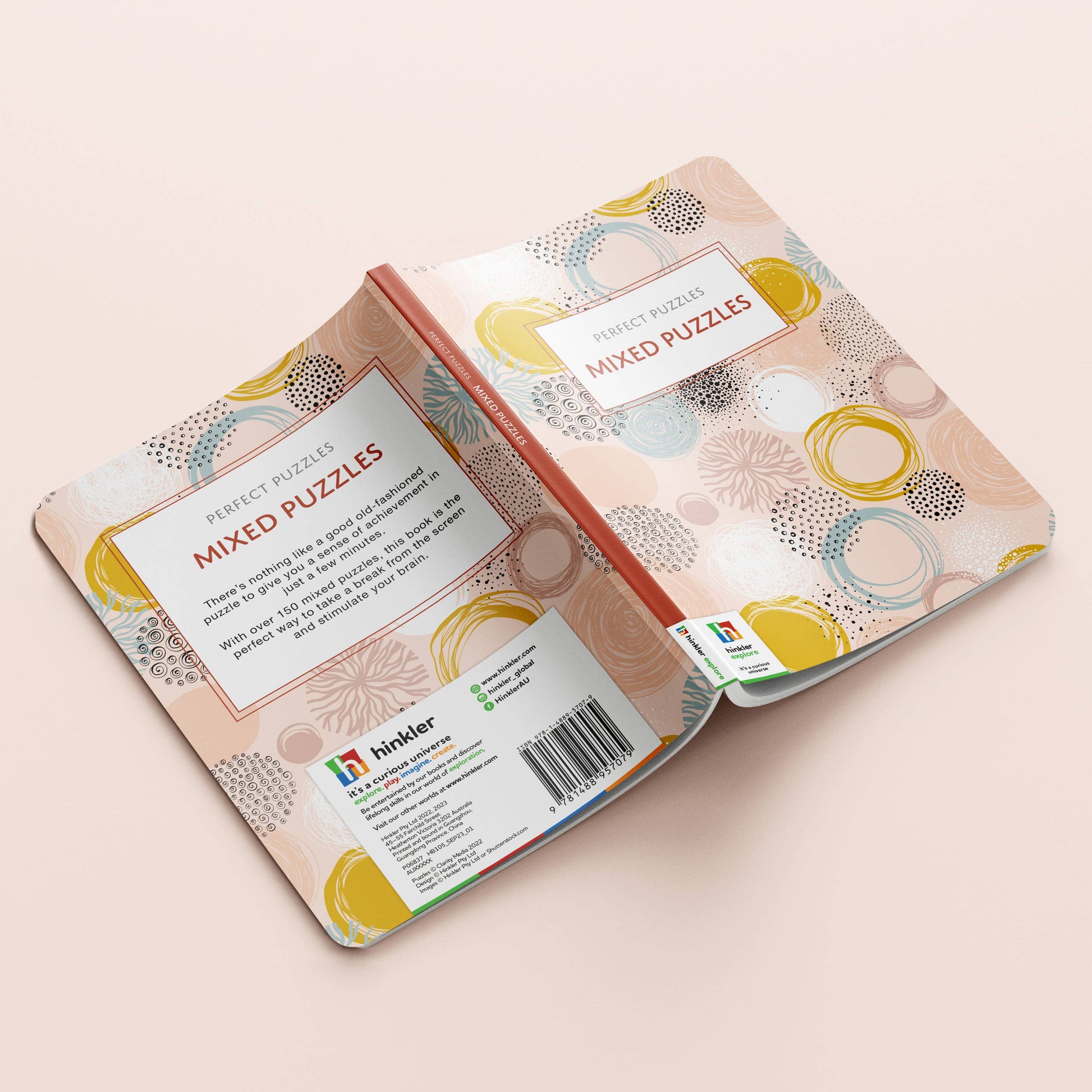 Packaging of 'Mixed Puzzles' with a decorative design on a light pink background
