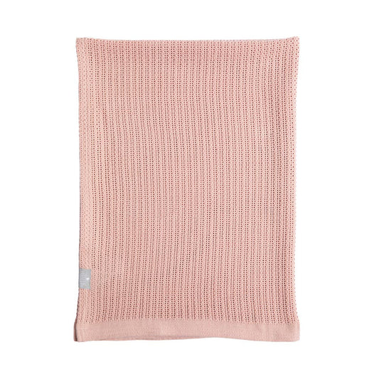Pink knitted blanket with a small gray tag on a white background