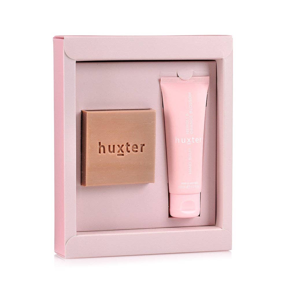Pink gift set with 'huxter' branding on a white background