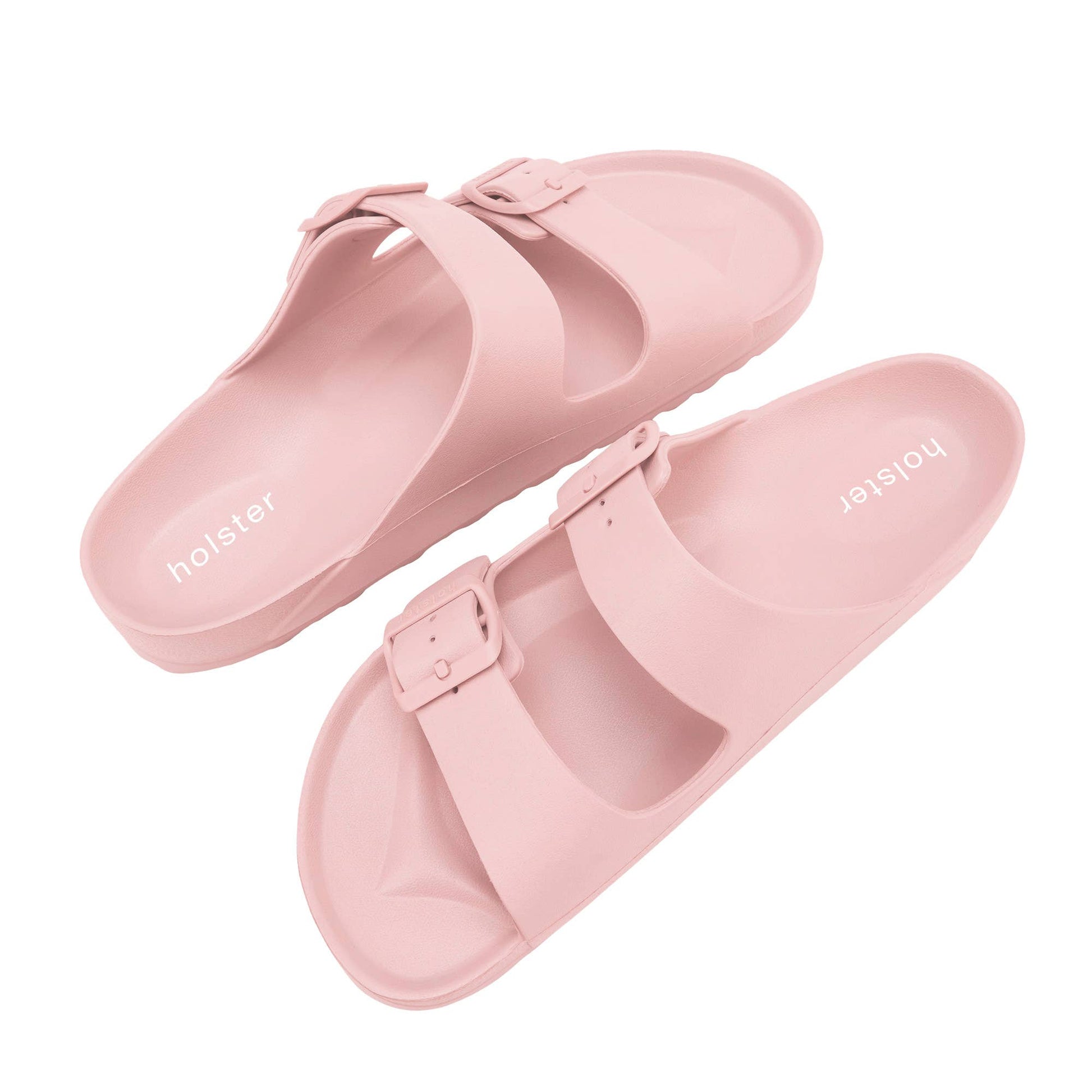 Pair of pink sandals with 'holster' branding on a white background
