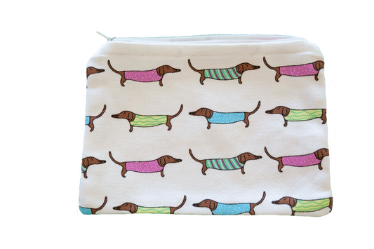 Pouch with dachshund pattern in colorful sweaters on a white background