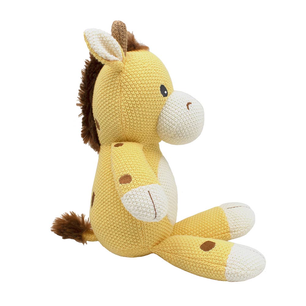 Knitted giraffe toy on a white background