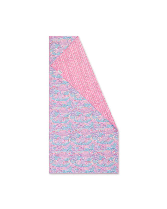 Pink and blue patterned towel on a white background