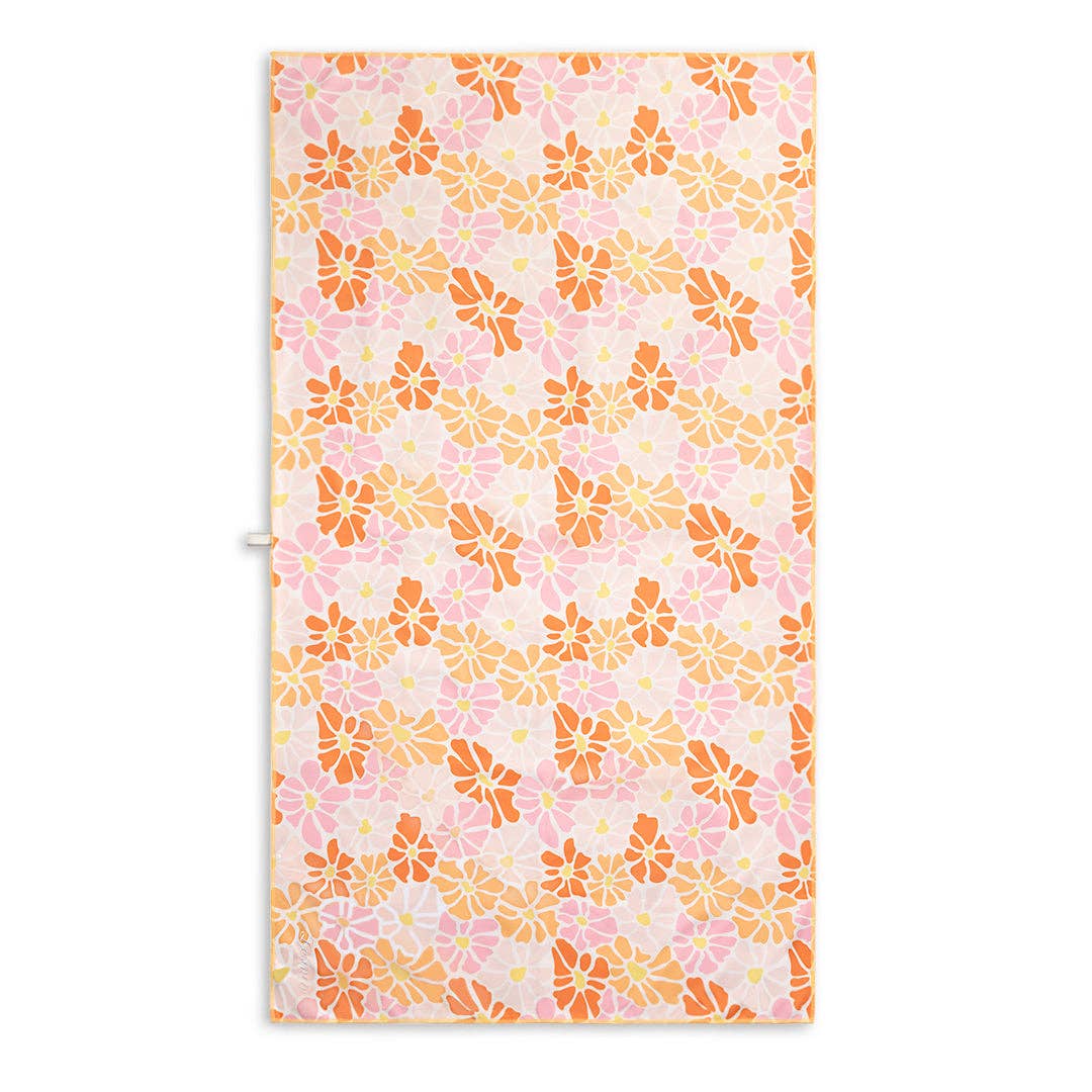 Floral patterned beach towel with pink and orange flowers on a white background