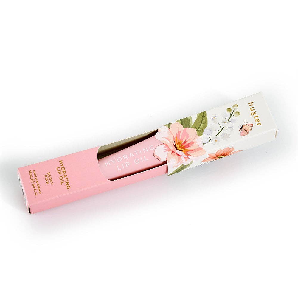 Pink lip balm with floral packaging on a white background