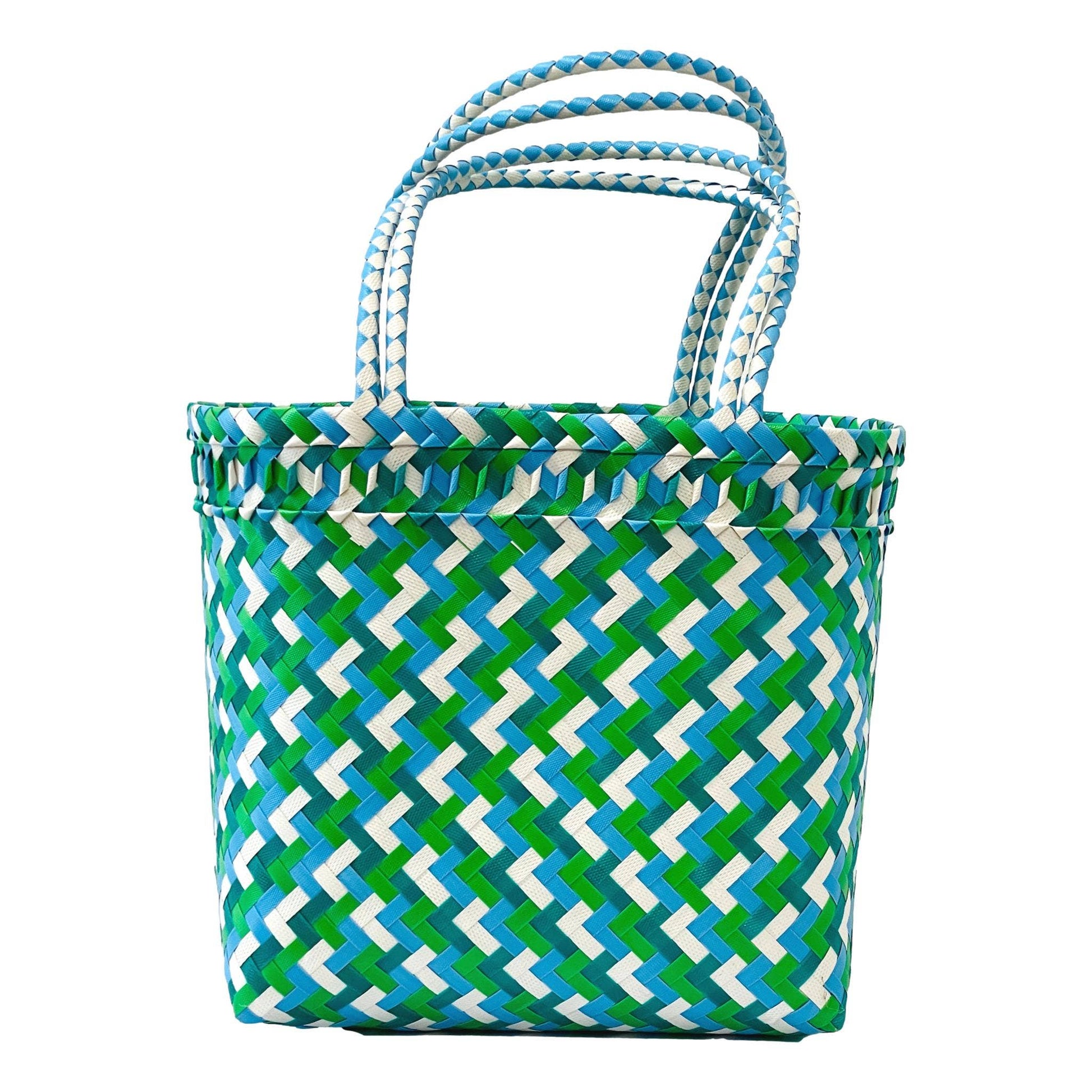 Tote bag with green and blue geometric pattern on a white background