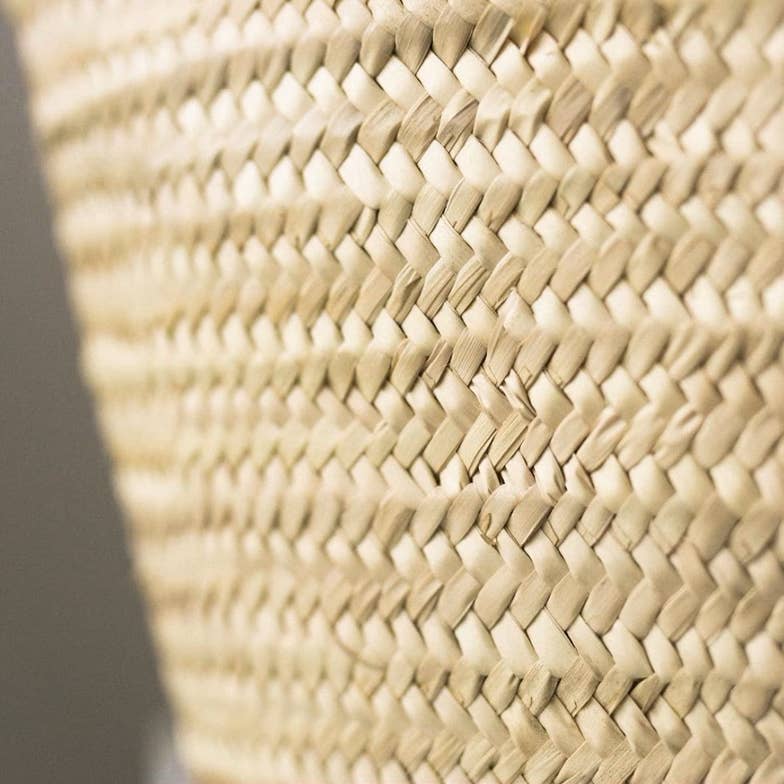 Close-up of a woven straw surface with a geometric pattern