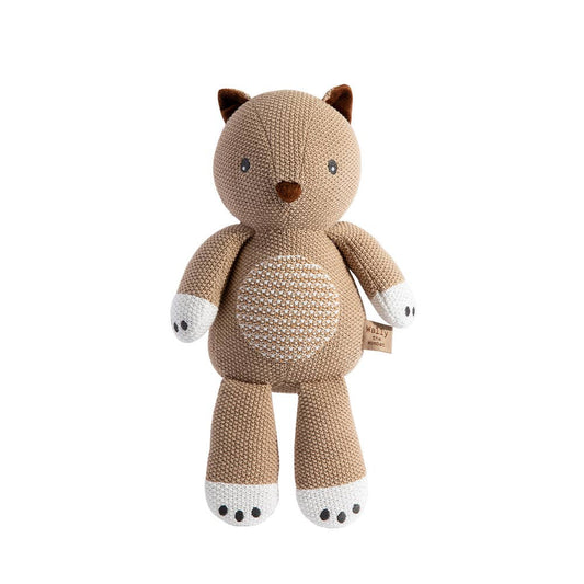 Knitted brown teddy bear toy on a white background