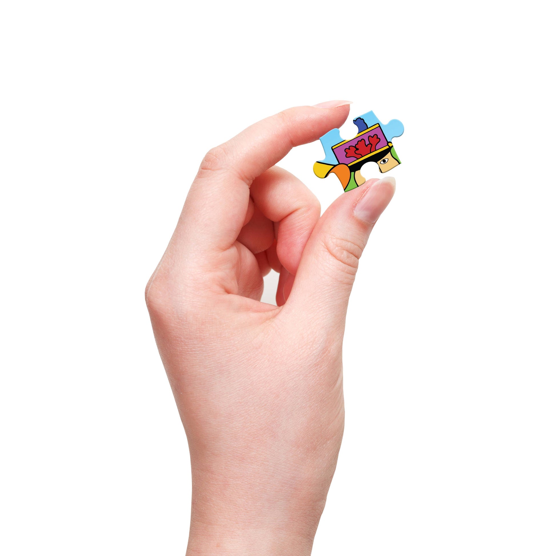 Hand holding a colorful puzzle piece against a white background