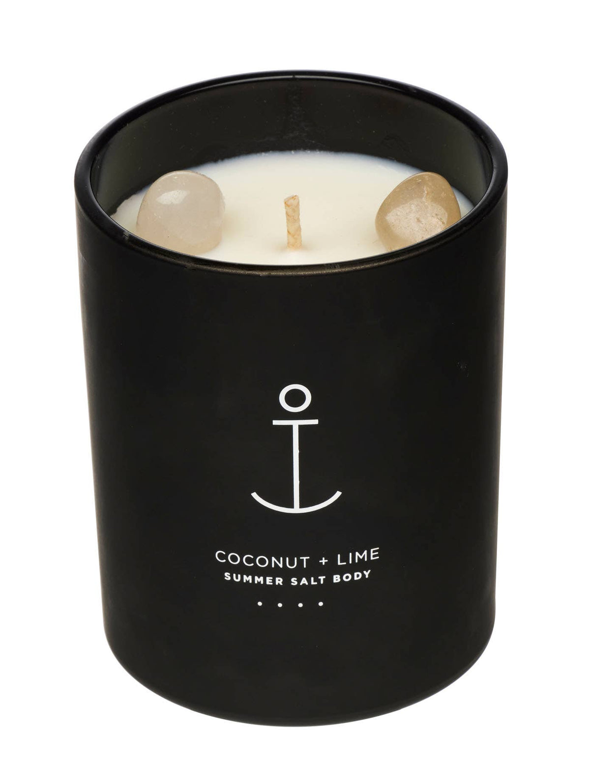 A black glass jar candle with white wax and two clear decorative stones, labeled 'COCONUT + LIME SUMMER SALT BODY' with a white anchor graphic, on a white background.