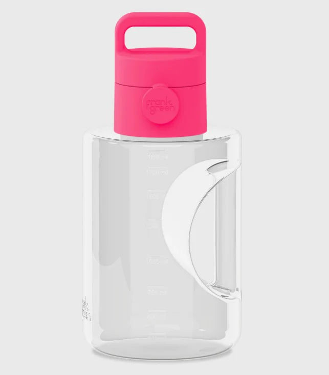 Clear pitcher with a pink lid on a white background