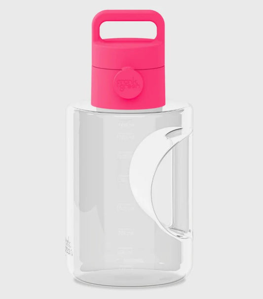 Clear pitcher with a pink lid on a white background